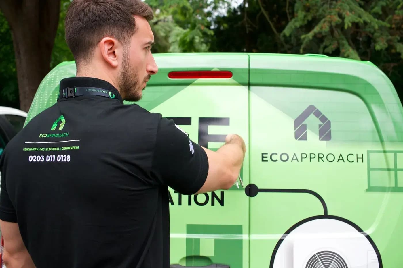 Eco Approach team member beside a green branded service van.